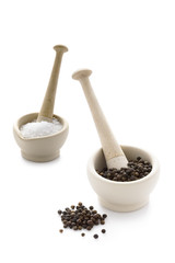 salt and pepper in pestle and mortars