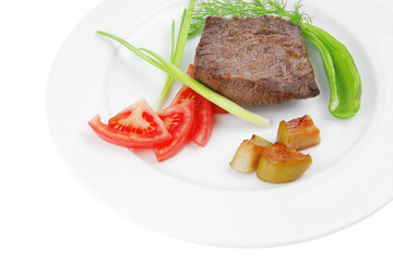 meat food : roasted fillet mignon on white plate with tomatoes a