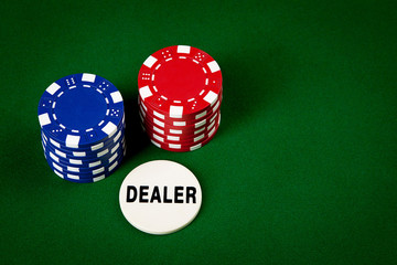 chips for poker on green playing table