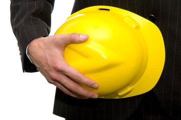 Engineer holding yellow helmet