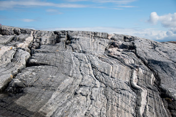 Large gray rock on the sky background