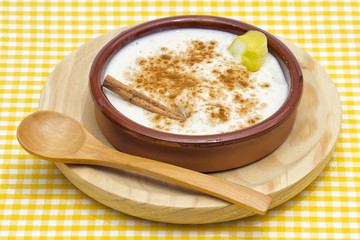 Fototapeta na wymiar Rice pudding in a ceramic bowl