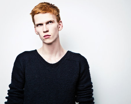 Young Red Haired Man On Light Background.