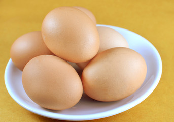 food background from a brown and yellow eggs