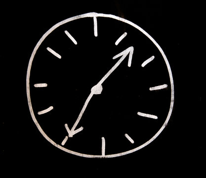 white choc clock on black wall