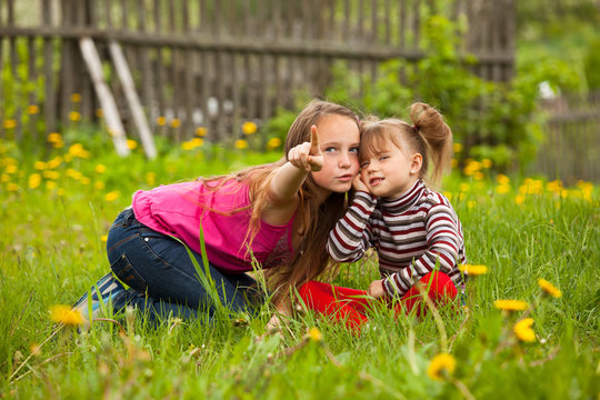 Little girl with his sister in the park