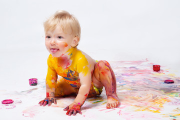 Little girl painting in studio