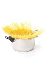 spaghetti noodles in a pot on a white background