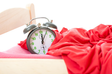 old vintage clock in little bed