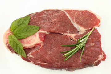 Raw Lamb steak with mint and Rosemary