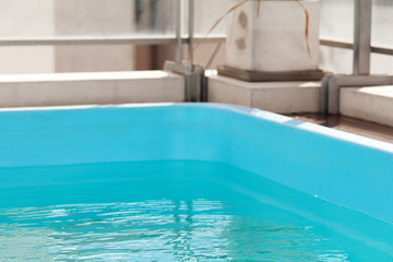 Fototapeta na wymiar background of the blue swimming pool