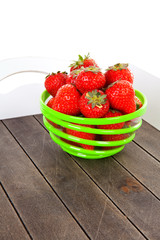 Tray with bowl of fresh strawberries