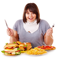 Woman eating fast food.