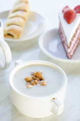 Mushroom Soup with Toast, strawberry cake and tea as background,