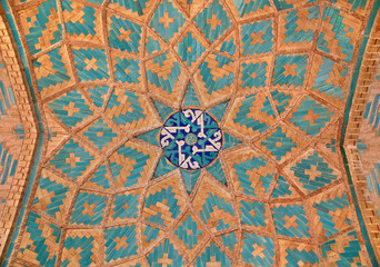 Brickwork mixed with blue tiles inside an old mosque