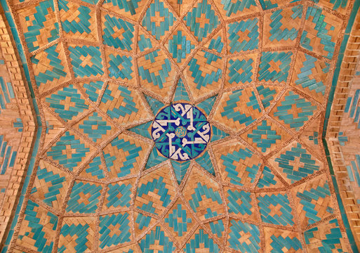 Brickwork mixed with blue tiles inside an old mosque