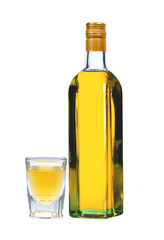 bottle of vodka with pepper and glass isolated on white