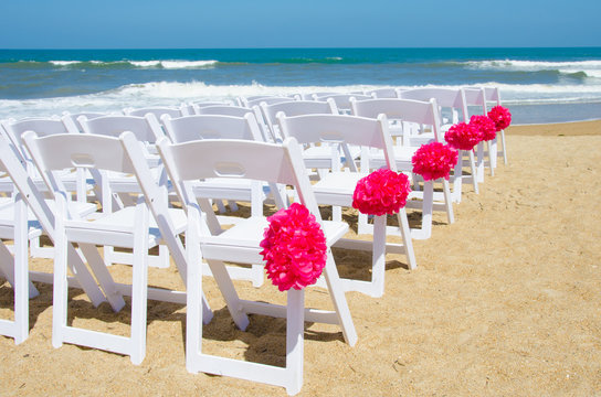 Chairs set up for wedding on the beach