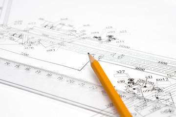 pencil and ruler against the unpacked drawing