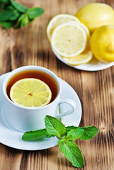 Cup of tea with mint and lemon