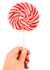 candy pink spiral lollipop in hand