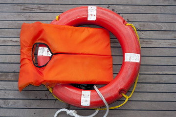 Orange life jacket.