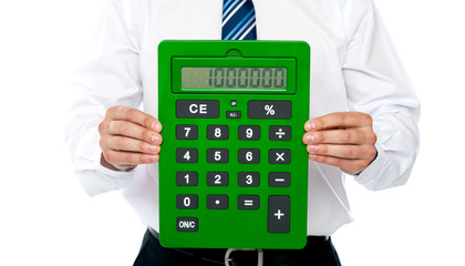 Closeup of a green calculator. Man holding it