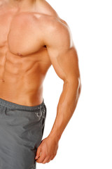 A young man's chest and abs on white