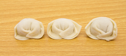 homemade meat dumplings on a cutting board