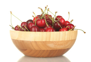 cherry in wooden bowl isolated on white