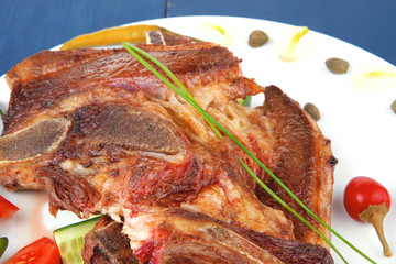 beef meat fillet on white plate with tomatoes