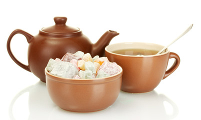Teapot with cup and saucer with  sweet turkish delight isolated