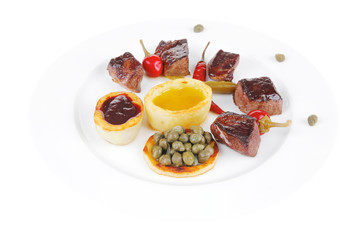 food: grilled meat goulash on white plate