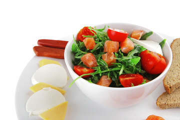 salad with smoked salmon in white bowl
