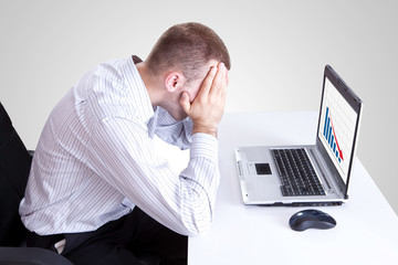 man looking at a bad results chart