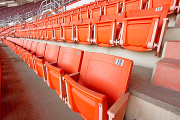 plastic seats in very big, empty stadium