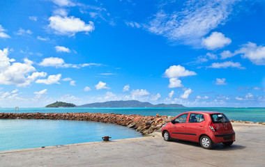 car on tropical beach © nadezhda1906