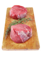 red raw fillet chops : two fresh beef meat chops with small thym
