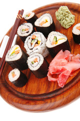 sushi rolls on wood with wasabi and ginger