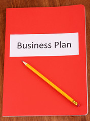 Red folder labeled business