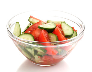 Fresh salad with tomatoes and cucumbers isolated on white