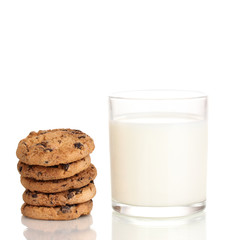 Glass of milk and cookies isolated on white