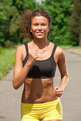 Fototapeta premium Athlete woman jogging outdoors