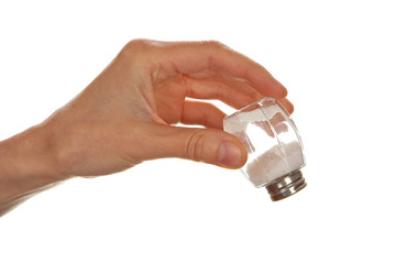 Female hand holding salt cellar
