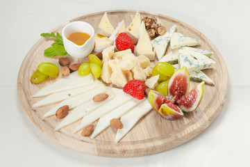 Various types of cheese on a cheese platter
