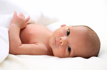 Portrait of a cute one-week old baby boy