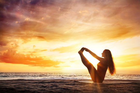 Yoga at sunset beach