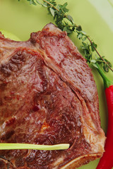 savory : grilled spare rib on green dish with pepper and tomato