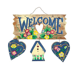 Welcome sign with two wood hearts and a small cottage