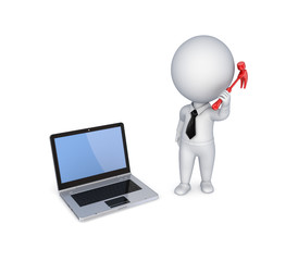 Modern notebook with a hammer in a hand.